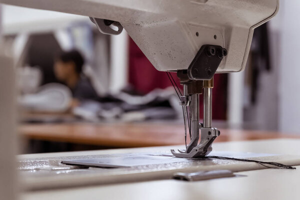 Sewing machine needles close-up in the workshop