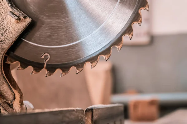 Sawing machine for wood in the workshop for the production of furniture. Woodworking circular saw for cutting.