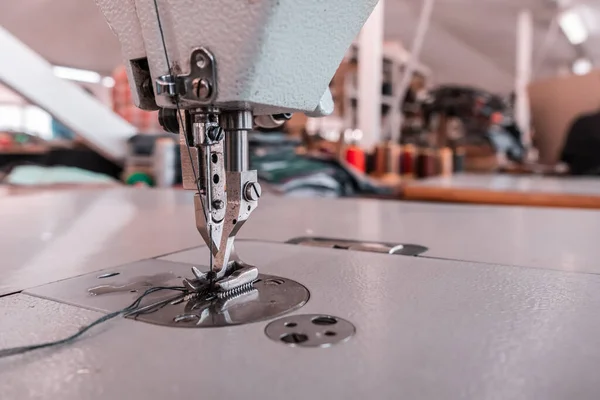 Sewing machine needles close-up in the workshop