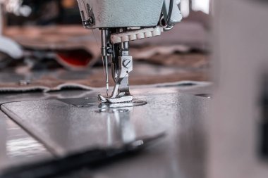 Sewing machine needles close-up in the workshop