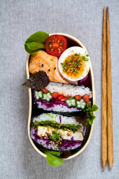 Japanese lunch with tofu onigirazu and salmon