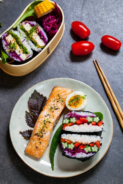 Japanese lunch with tofu onigirazu and salmon