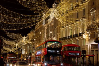 LONDON, UK - DECEMBER 4th, 2017: Christmas lights on Regents Street St James. Beautiful Christmas decorations attract  shoppers and tourists during the festive season.