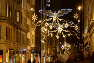 LONDON, UK - DECEMBER 4th, 2017: Christmas lights on Jermyn Street. Christmas decorations attract thousands of shoppers and tourist during the festive season in London.