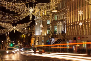 LONDON, UK - DECEMBER 4th, 2017: Christmas lights on Regents Street St James. Beautiful Christmas decorations attract  shoppers and tourists during the festive season.