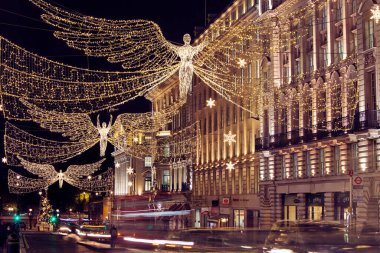 LONDON, UK - DECEMBER 4th, 2017: Christmas lights on Regents Street St James. Beautiful Christmas decorations attract  shoppers and tourists during the festive season.
