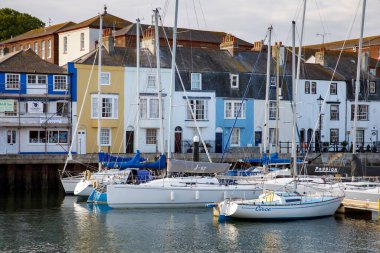 WEYMOUTH, UK - MAY 24th, 2019: Old harbour is a picturesque area at the seaside town of Weymouth in Dorset, southern England.