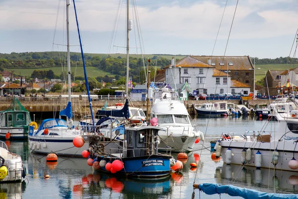 WEST BAY, UK - MAY 26th, 2019: West Bay, also known as Bridport Harbour, is a small harbour settlement and resort on the English Channel coast in Dorset.