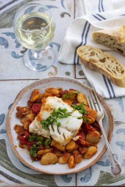 Spanish dish of cod with butter beans, tomatoes and chorizo