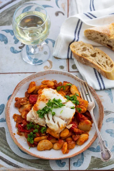 Spanish dish of cod with butter beans, tomatoes and chorizo