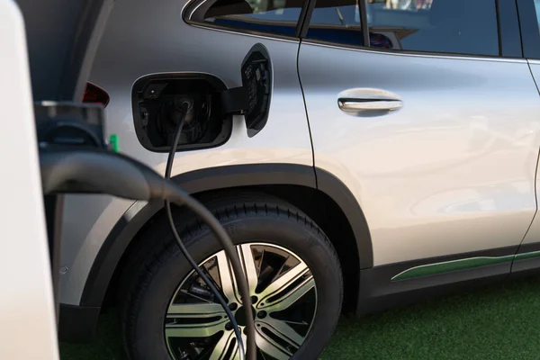 Electric car with a charger — Stock Photo, Image