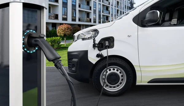 Electric vehicles charging station on a background of a van. Concept