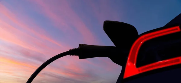 Silhouetten Von Elektroauto Und Ladestation Vor Dem Hintergrund Des Sonnenuntergangs — Stockfoto