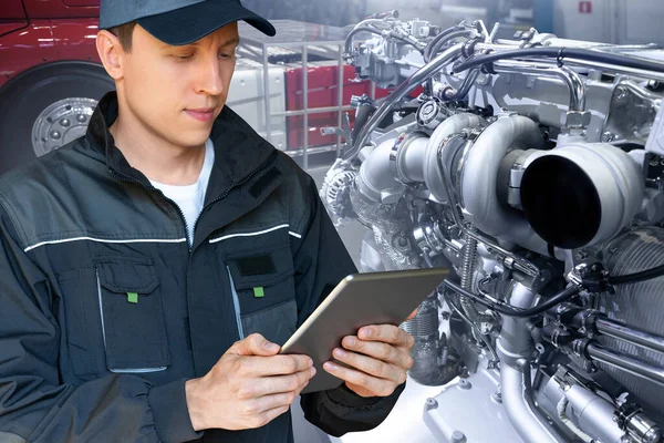 Mechanic Repairing Truck Engine Garage Using Digital Tablet — Stockfoto