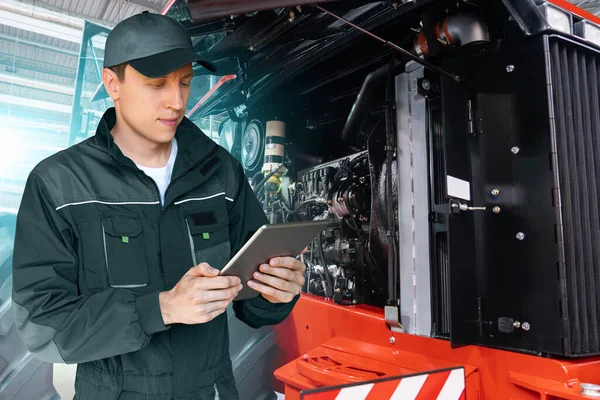 Serviceman Digital Tablet Background Tractor Open Hood — Stockfoto