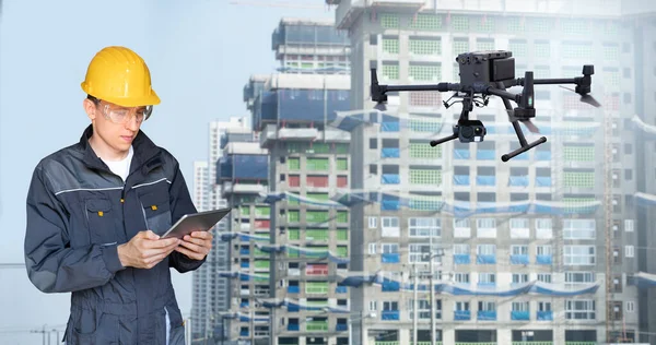 Engineer Digital Tablet Controls Drone Construction Site — 图库照片