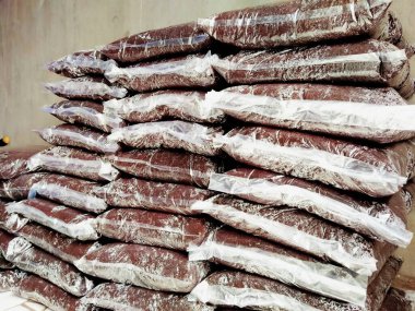 soil planting media is packed in plastic, neatly arranged for use or sale.
