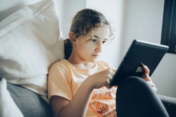 young woman with tablet pc and digital book