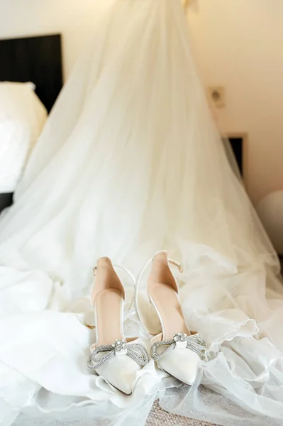 white wedding dress and shoes with accessories.
