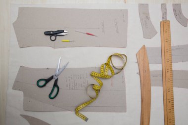 tailor's supplies, such as scissors, meters, and rulers