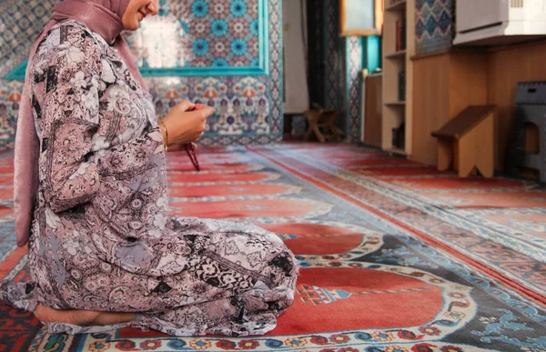 woman is praying in mosque