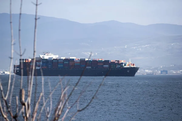 giant ship carrying cargo at sea