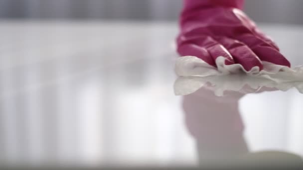 Woman cleaning and polishing the kitchen worktop with a spray detergent, housekeeping and hygiene concept — Stock Video