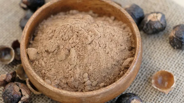 pile of ground soap nut powder for ecological washing. The raw fruit arita or rita, also known as soap nuts, is the main ingredient in any soap and shampoo.