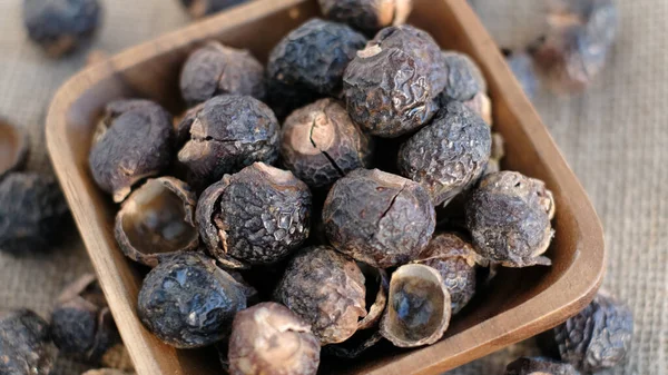 heap of soap nut for ecological washing. Raw Aritha or Reetha fruit also known as Soap-nuts which is the main ingredient in any soaps and shampoos.