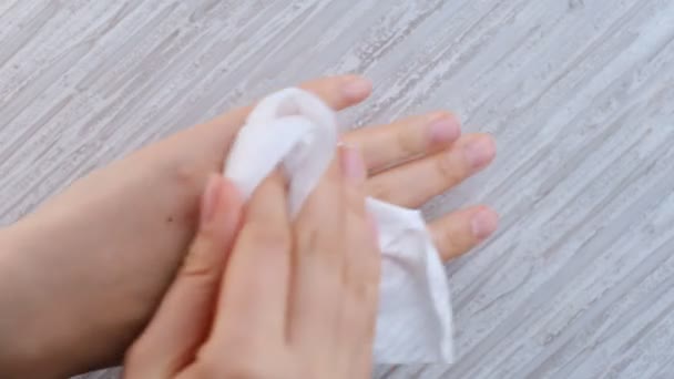 Woman hands wiping using white alcohol tissue cleaning disinfection from virus and bacteria. Close-up shooting stock footage. soft focus. — 비디오