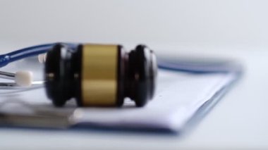 Gavel and stethoscope. medical jurisprudence. legal definition of medical malpractice. attorney. common errors doctors, nurses and hospitals make. Close-up shooting stock footage. slow motion