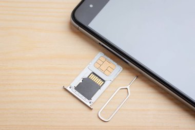 Inserting tray for SIM card and memory drive to the mobile phone. Expanding memory in a mobile phone