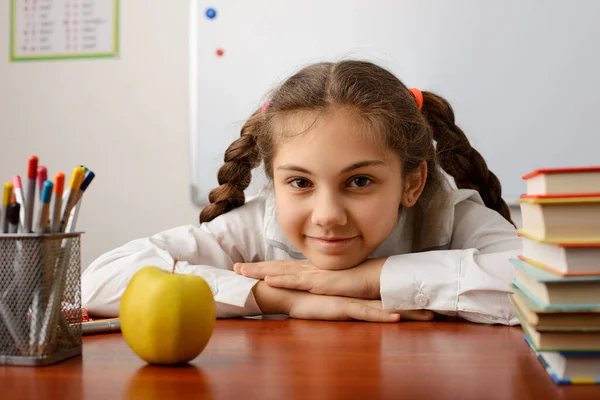 Playful Cheerful School Girl Sitting Desk Books Pencils Apple Lesson — Stockfoto