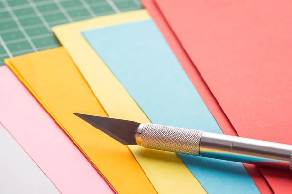 Paper Knife Pile Different Coloured Papers — Stockfoto