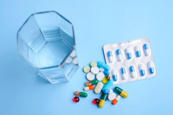 Glass Water Pills Various Shape Color Blue Background Concept Medicine — Stok fotoğraf