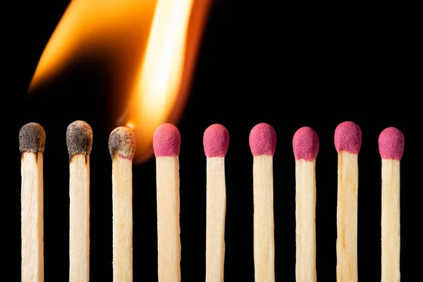 Line Matches Igniting One One Burning Matches Black Background — Φωτογραφία Αρχείου