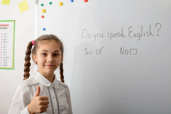 Schoolgirl English Learner Showing Thumbs Standing Board Inscription You Speak — Stockfoto