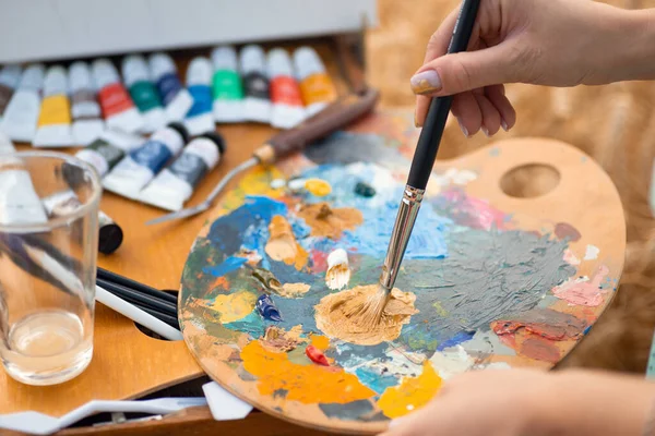 Oil Colors Palette Close Hand Woman Painter Holding Brush Mixing — Fotografia de Stock