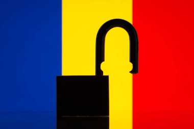 Flag of Romania and open lock on the foreground. Open country, travel concept