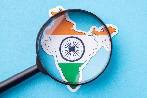 Magnifying glass on the map of India. Studying Indian culture, traditions, facts