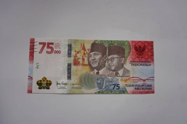 Bank Indonesia ( BI ) launched a new 75 thousand rupiah banknote to coincide with the 75th Indonesian Independence Day. Yogyakarta, Indonesia - July 17th, 2022.