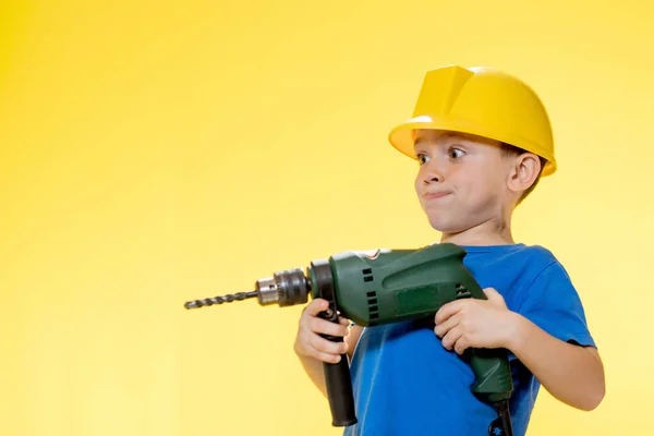 Cute Boy Construction Helmet Drill His Hands — Fotografia de Stock