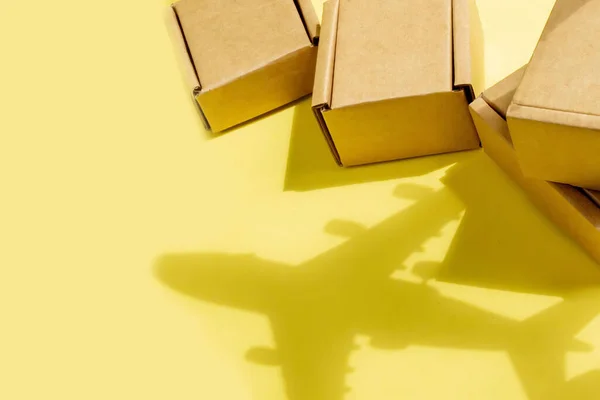 Shadow Airplane Stack Cardboard Boxes Concept Air Cargo Parcels Airmail — Stock fotografie