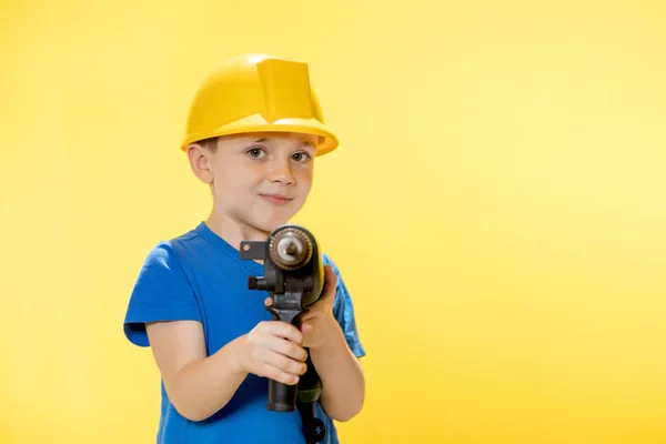 Cute Boy Construction Helmet Drill His Hands — Fotografia de Stock