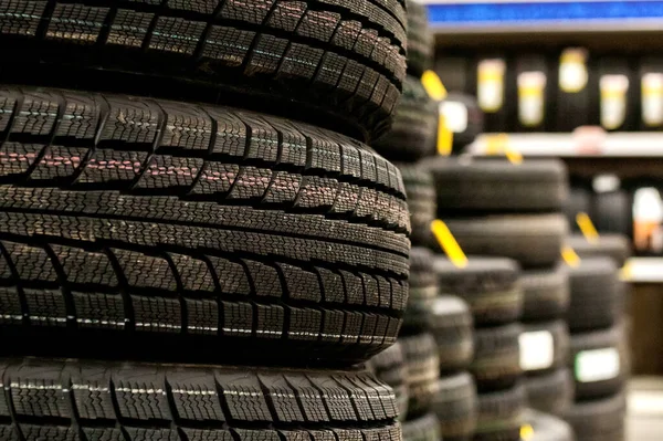 Car tires and wheels at warehouse in tire store