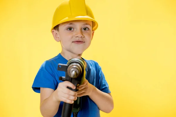 Cute Boy Construction Helmet Drill His Hands — Fotografia de Stock