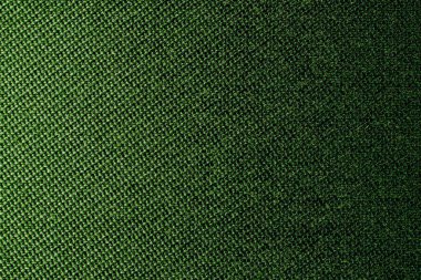 Hasır desenli tekstil malzemesinin koyu yeşil arka planı, yakın çekim. Zeytin dokusunun yapısı. Kumaş arkaplanı.