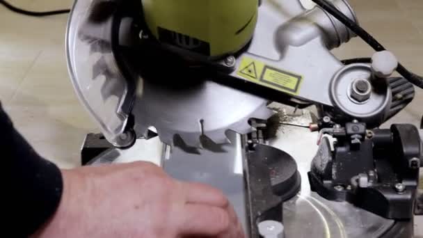 Worker Cutting Baseboard Circular Saw Installing — Stock Video