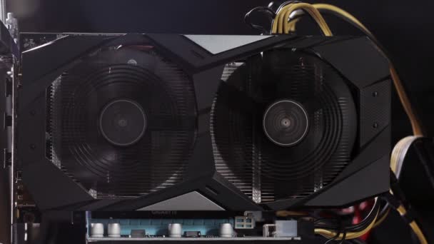 Close up details of modern mining rig with gpu, graphics cards used for creating bitcoin digital currency. Electronic devices with fans. Cryptocurrency miners. — Vídeo de Stock