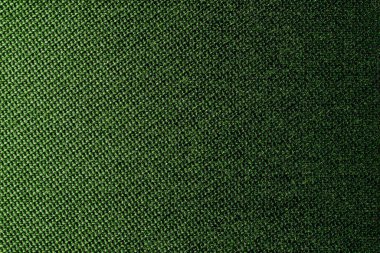 Hasır desenli tekstil malzemesinin koyu yeşil arka planı, yakın çekim. Zeytin dokusunun yapısı. Kumaş arkaplanı.